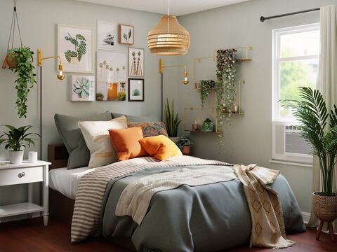 lit blanc avec draps gris et blancs, coussins gris, blans et oranges